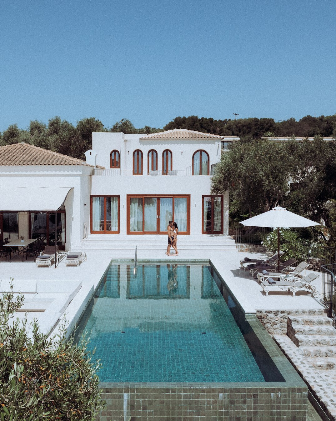 celebrity villa exterior with pool